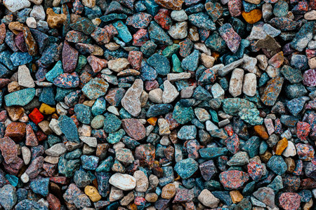 Background with the texture of colored rough pebbles. Dark wet pebbles. Photo from aboveの写真素材