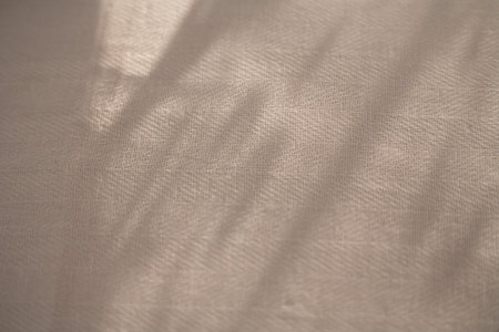 Abstract background. Lightweight cotton fabric. Shadows from curtains on fabric. Pattern from...