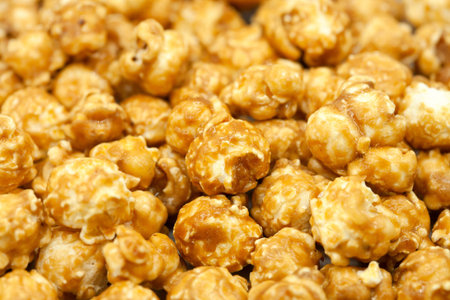 Popcorn in caramel close-up. Macro photography. Caramelized popcorn. Popcorn background.の写真素材