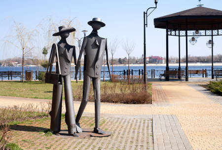 Metal sculptures of men and women on the embankment of the Dnieper River. Ukraine, Kiev, April 10, 2021.のeditorial素材