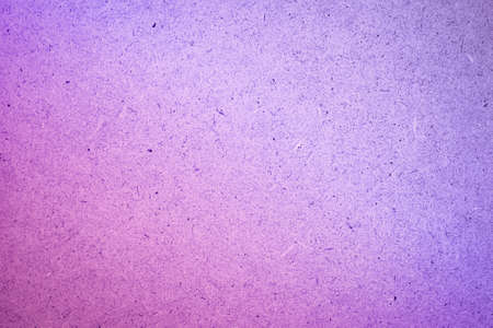 Plywood board with grain and dots texture. Pink-purple tinted, Very Peri. Free space for text.の写真素材