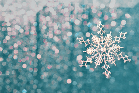 christmas background with highlights and silvery snowflakesの写真素材