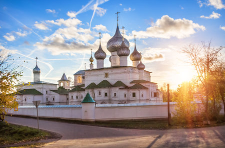 Resurrection monastery in Uglich, lit by the evening rays of the autumn sun, and white clouds
