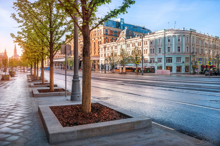 The building of the Yermolova Theater on Tverskaya Street in Moscow and the Kremlin towers in the distance on a sunny morningのeditorial素材