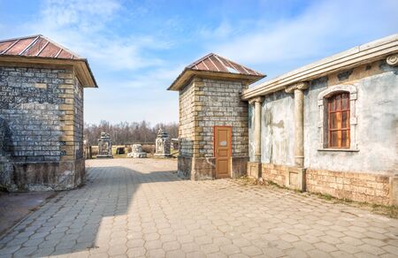 Artificial scenery of brick towers at the entrance to the old city street in Kinogorodka in Leninsky Hills in spring sunny dayの写真素材