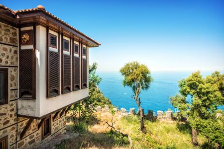 House with closed shutters overlooking the Mediterranean Sea in Turkey in Alanya on a sunny dayの写真素材