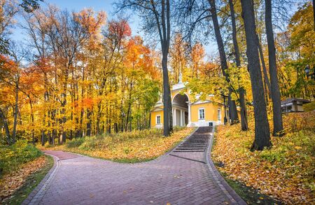 Milovida Pavilion in Tsaritsyno park in Moscow among autumn golden trees on an early sunny morningの写真素材