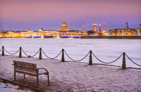 View of the Rostral Column, St. Isaac's Cathedral and the Kunstkamera near the Stock Exchange in St. Petersburg on a lilac winter nightの写真素材