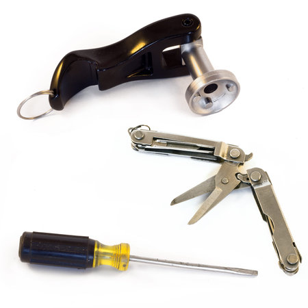 Screwdriver, Pocket Knife with pliers, bicycle key. isolated on white