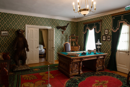 Chudovo, Russia - October 08, 2022: House-museum of the poet NA Nekrasov. The interior of the writer's office with authentic items of the 19th centuryのeditorial素材