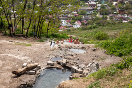 Pyatigorsk, Russia - May 10, 2022: People bathe in thermal mineral springs (folk baths) on the slope of Mount Mashuk in Pyatigorskのeditorial素材
