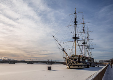 St. Petersburg, Russia - February 12, 2023: Winter St. Petersburg Petersburg. A replica of the old frigate "Blagodat" is moored at the Petrovskaya embankment of the Neva Riverのeditorial素材