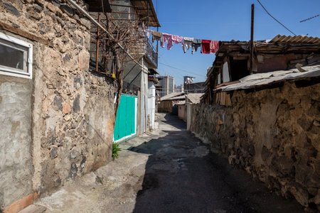 Yerevan, the historical quarter of Kond. Clothes dry on a rope across a narrow streetの写真素材