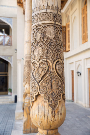 Traditional Uzbek craft wood carving. Wooden column with carved floral ornament, Bukhara, Uzbekistanの写真素材
