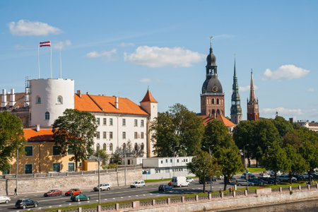 Riga castle, dome Cathedral, the Church of St. Peter and the Anglican Church on the Daugava river embankmentの写真素材