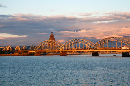 Picturesque sunset over the Railway Bridge in Riga, Latviaの写真素材