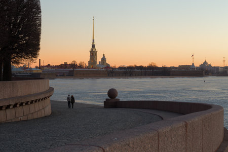 Couple meets a dawn on the Spit of Vasilievsky island. Saint Petersburg, Russiaの写真素材