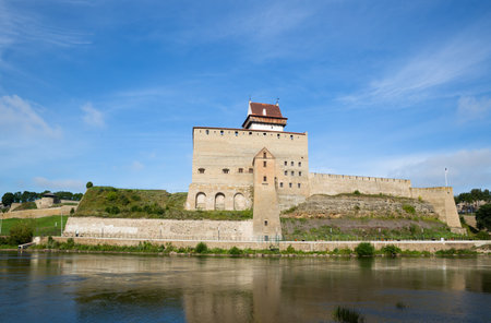 Narva castle on the river bank in summer dayの写真素材