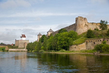 Two ancient fortress - Ivangorod, Russia and Narva, Estonia on the opposite banks of the river.の写真素材