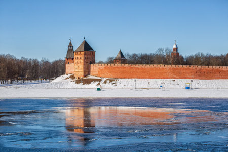 Early spring in Veliky Novgorod. The towers of the Novgorod Kremlin are reflected in the floating ice floesの写真素材