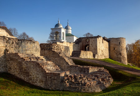 Fortress walls and towers of the Izborsk fortress and the Church of St. Nicholas the Wonderworker,...