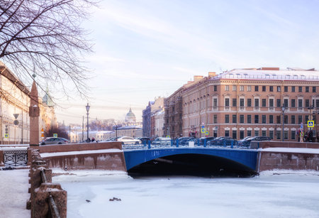 Winter Petersburg. Blue bridge and ancient buildings on the embankments of the Moika Riverの写真素材