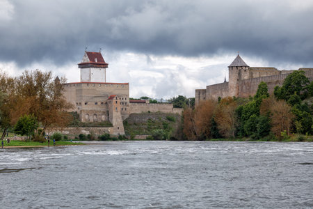 Hermann Castle (Estonia) and the opposite Ivangorod Fortress (Russia), with the Narva river in betweenの写真素材
