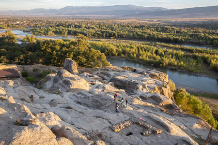 Uplistsikhe, Georgia - September 30, 2018: People at the ruins of the ancient cave city of Uplistsikheの写真素材