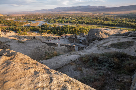 Uplistsikhe, Georgia - September 30, 2018: People visit the ruins of the ancient cave city of Uplistsikheの写真素材