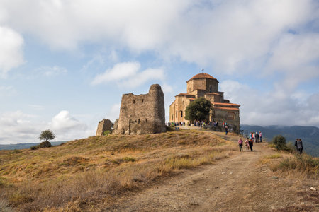 MTSKHETA, GEORGIA - SEPTEMBER 23, 2018: Many people visit the ancient Jvari monastery on mountain...