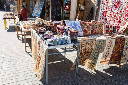 BUKHARA, UZBEKISTAN - OCTOBER 19, 2016: Uzbek souvenirs. Female saleswoman sells handicrafts on the streets of Bukharaのeditorial素材