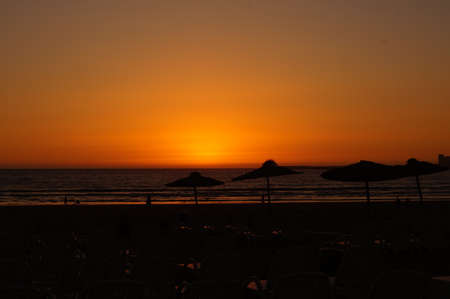 Beautiful rays of the setting sun on the oceanの写真素材