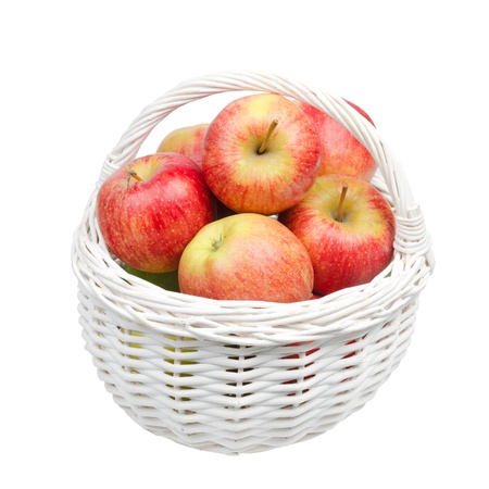basket with juicy red apples isolated on a white backgroundの写真素材