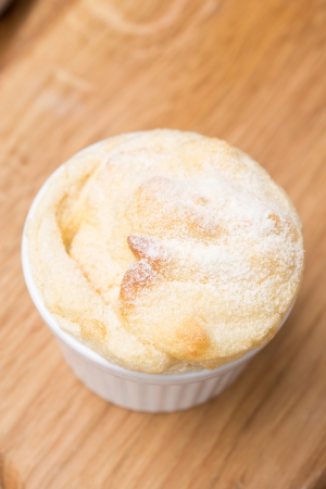 form with peach souffle on wooden board, top view, verticalの写真素材