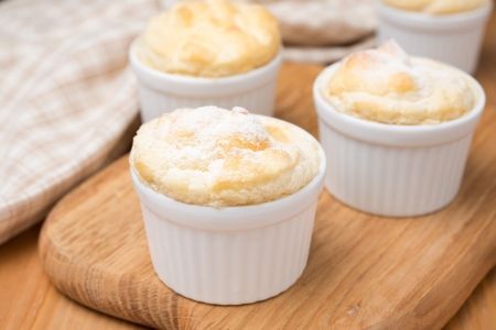 peach souffle in the portioned form on a wooden board, close-upの写真素材