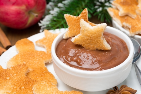 toast in the shape of stars and little men with chocolate and apple butter for Christmas, close-up, horizontalの写真素材