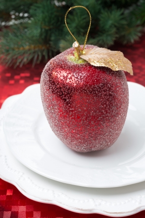 Christmas table place setting with a decorative apple, close-up, verticalの写真素材