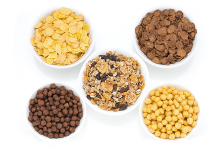 assortment dry cereal for breakfast, isolated on whiteの写真素材