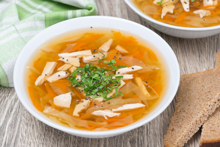 vegetable soup with chicken, top view, close-upの写真素材
