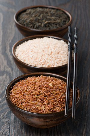 Assorted rice in bowl and chopsticks, verticalの写真素材