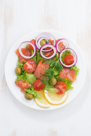 fresh salad with salted salmon, top view, vertical, close-upの写真素材