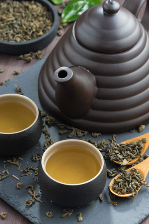 set for tea ceremony on a wooden table, close-up, vertical, top viewの写真素材