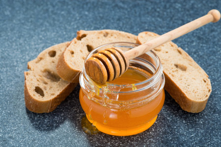 Jar with honey and bread
