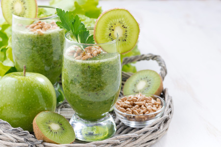 healthy green smoothie with sprouts and fresh ingredients, close-upの写真素材