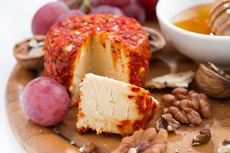 soft cheese and snacks on a board, close-upの写真素材
