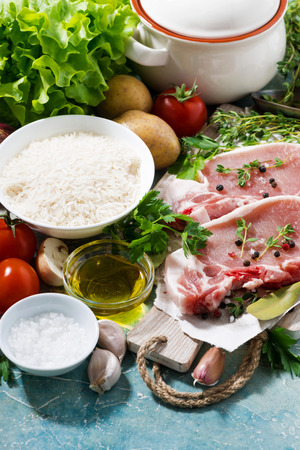 meat and fresh foods for cooking soup on a blue background, verticalの写真素材