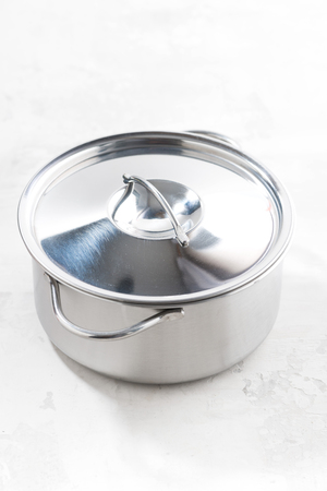 metal saucepan on a white background, vertical, top viewの写真素材