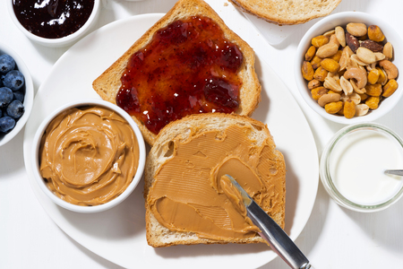 toast with peanut butter and jam for breakfast, top view, horizontalの写真素材