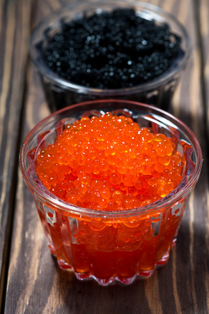 traditional red and black caviar in a jar, vertical top viewの写真素材