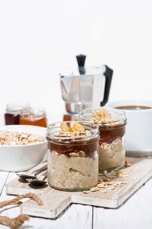 sweet oat pudding with jam and bananas for breakfast, vertical closeupの写真素材